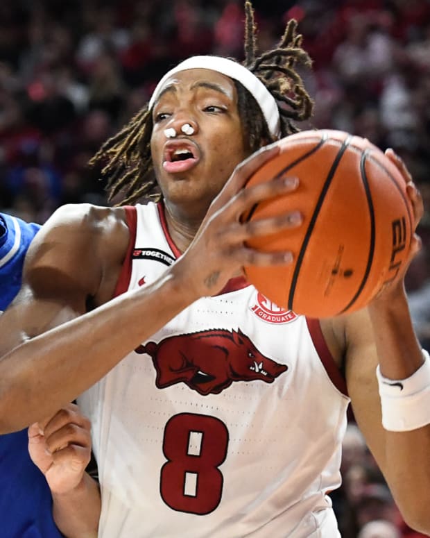 Razorbacks Chandler Lawson drives against Kentucky